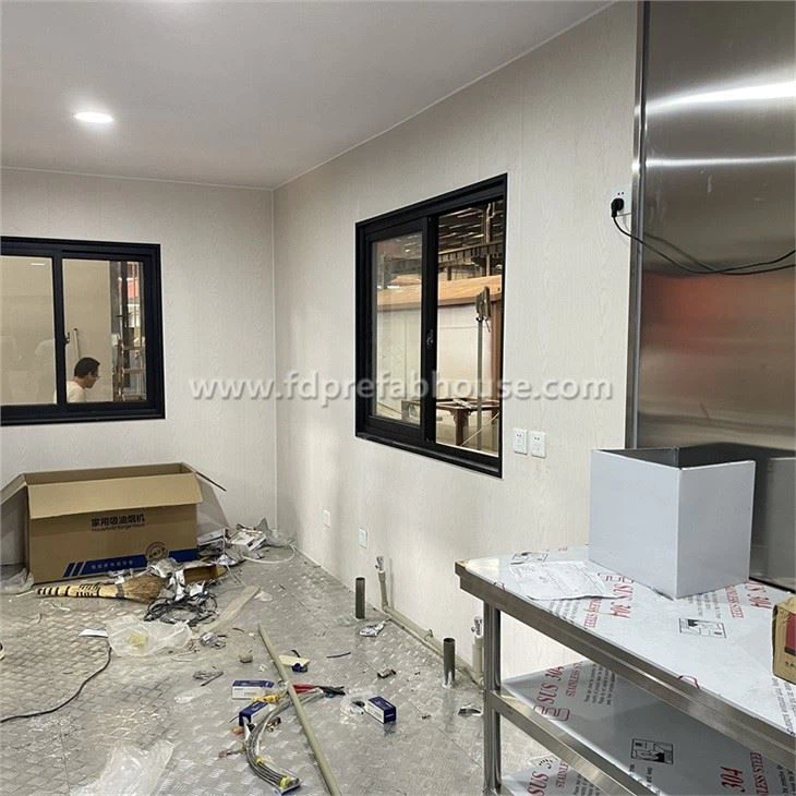 Decorated Container Kitchen With Metal Carved Panels